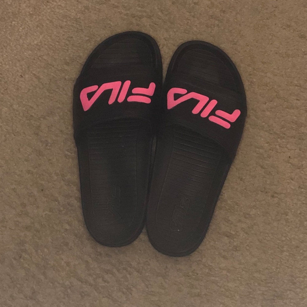 Black and pink FILA slides